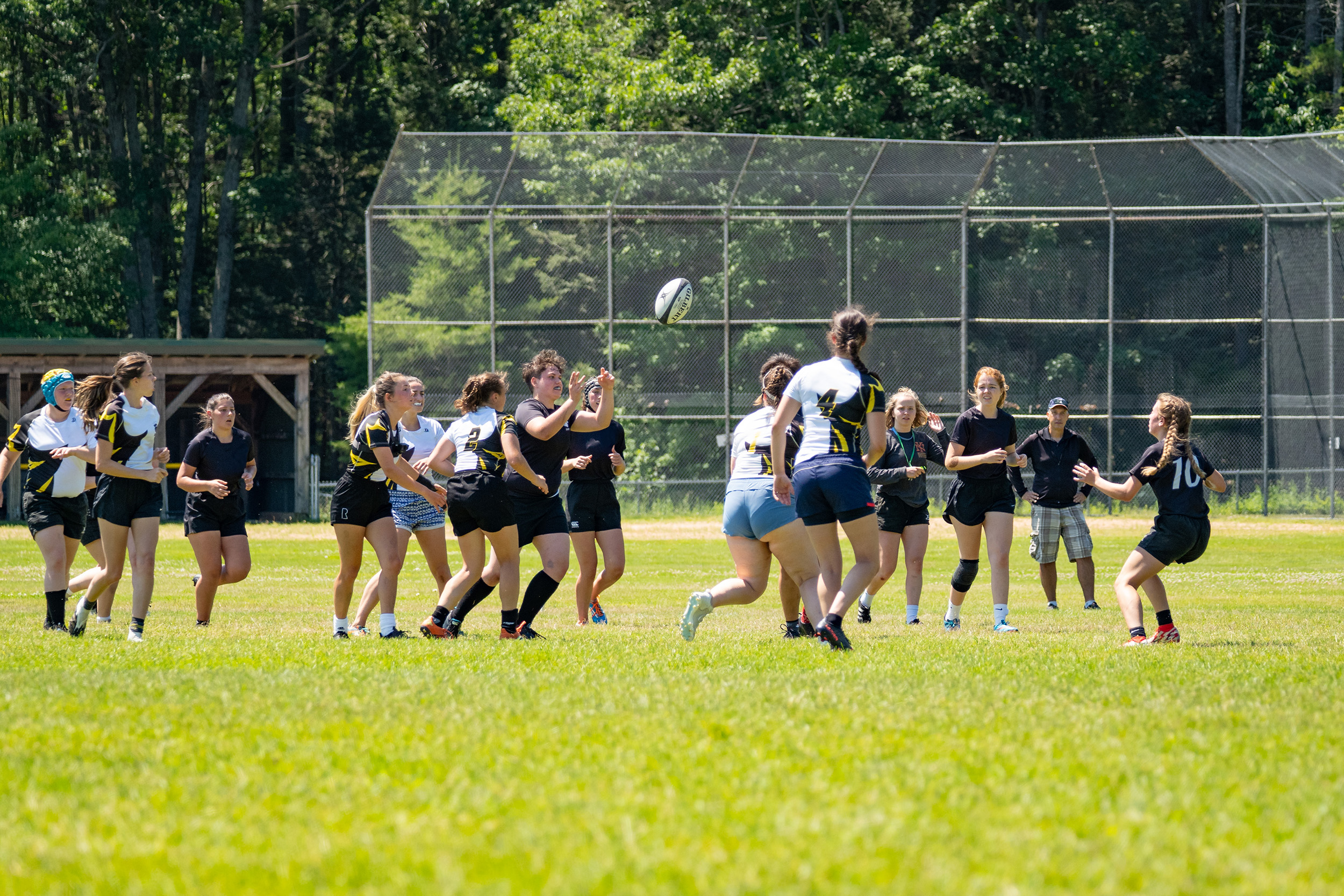 A team of players in black shirts versus a team in white shirts